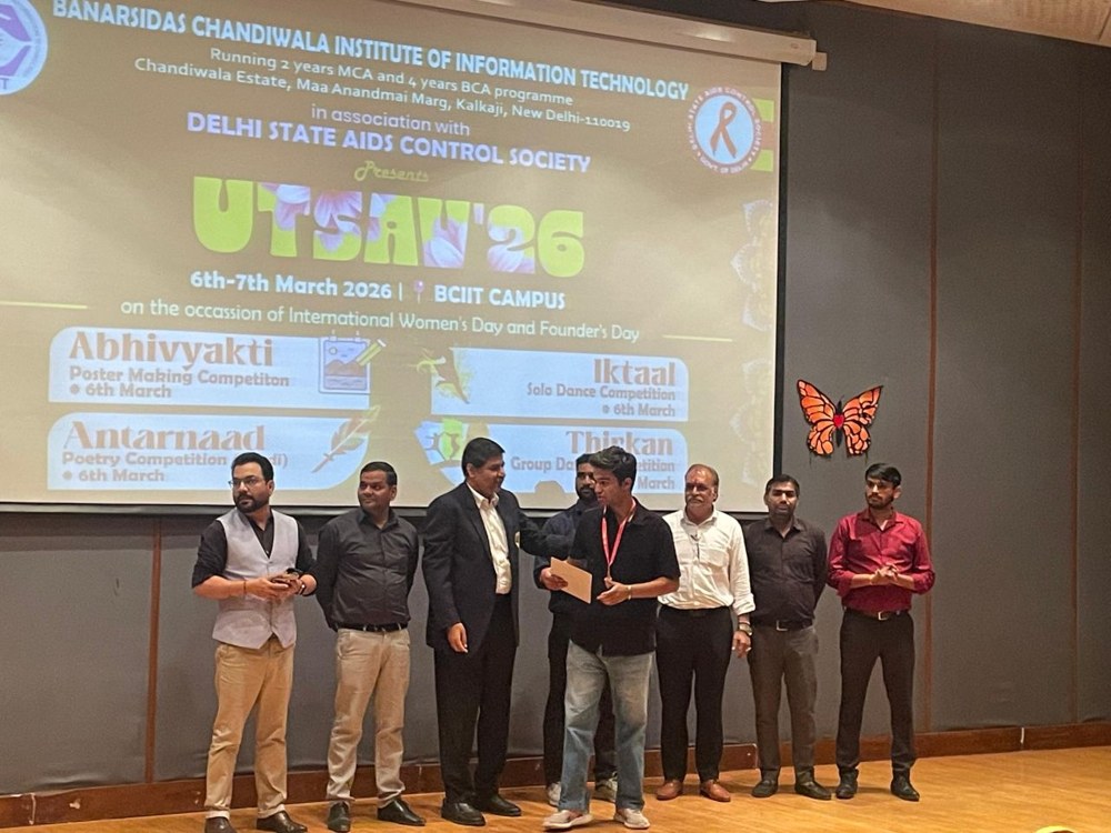 Aaditya receiving recognition on stage at BCIIT